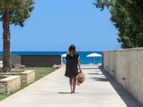 A luxury self-catering villa with intricate design and next to the sea.