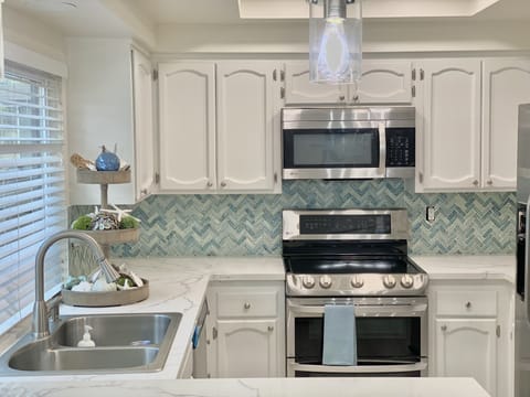 Fully stocked kitchen for entertaining. Keurig, in sink water filter. Ice-maker