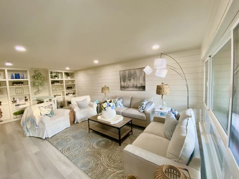 Luxurious living room with 70 inch tv., fireplace, workstation!