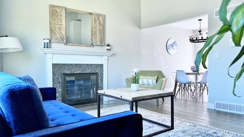 Light filled open plan living room with comfy couch.