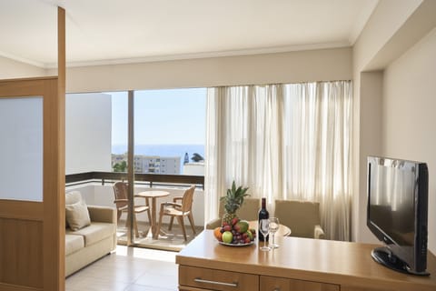 Junior Suite Inland View | Living area | 32-inch flat-screen TV with satellite channels, TV