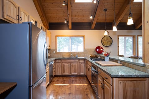 Enjoy a fully stocked kitchen featuring sleek stainless steel appliances, perfect for preparing meals with ease