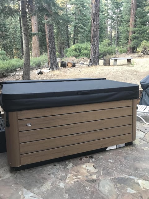 Unwind and relax in the hot tub, perfect for enjoying throughout the year, no matter the season