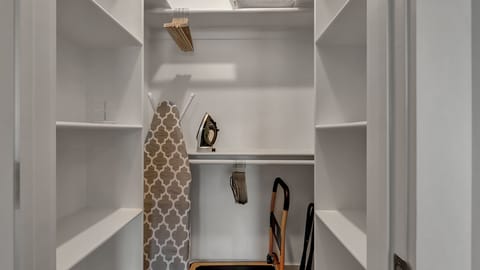 Primary bedroom walk in closet