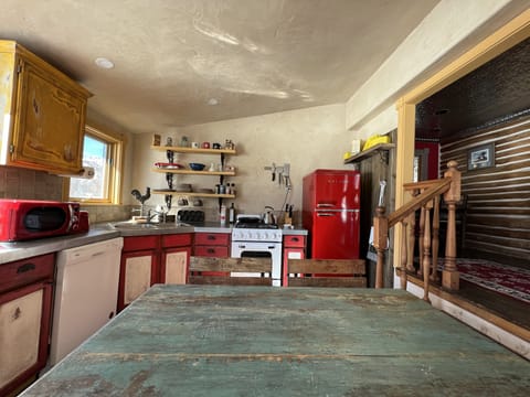 Retro kitchen, all new appliances, to left of entry, down 3 steps. 