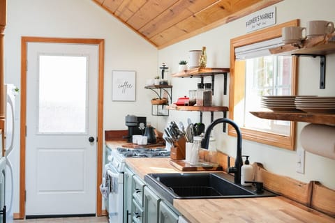 Experience the perfect blend of style and functionality with our large sink and butcher block counters, making meal preparation a breeze.