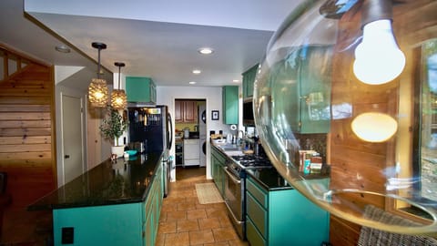 Unique light fixtures bring warmth to the living space