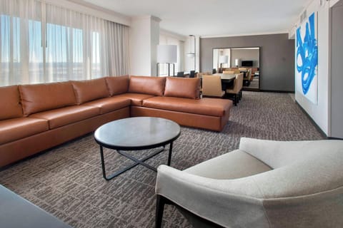 Suite, 1 King Bed | Living area | 37-inch flat-screen TV with cable channels, TV, iPod dock