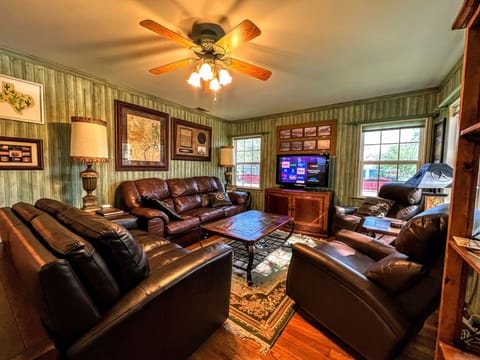 Livingroom area with plenty seating and Texas memorabilia abound  