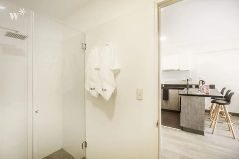 Studio (1305) | Bathroom | Shower, towels, soap, shampoo