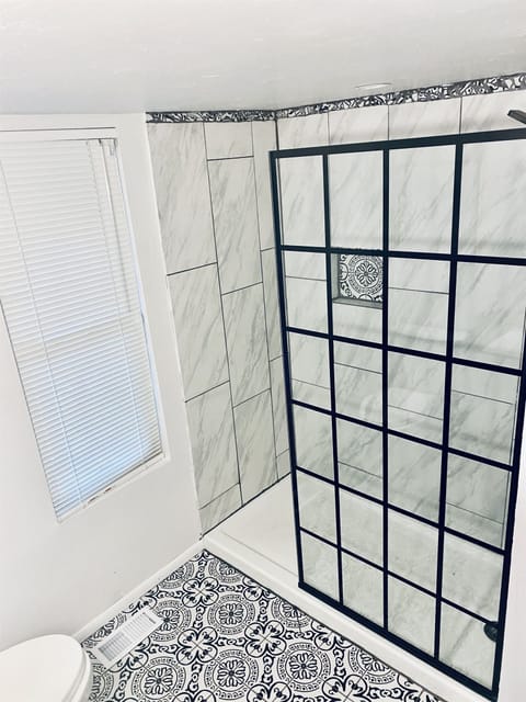 Designer bathroom with walk-in shower