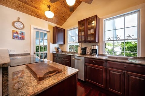 Fully stocked kitchen with cookware and appliances