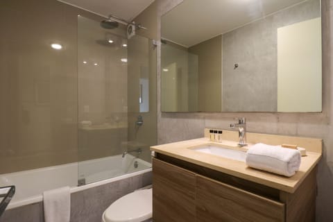 Economy Apartment | Bathroom | Combined shower/tub, rainfall showerhead, towels, soap