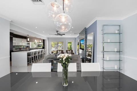 Spread out in the spacious layout of this Fort Lauderdale home, which offers 3 bedrooms & 3 full bathrooms, separate living area with a comfy sofa, a modern dining table, large fully-equipped kitchen with updated appliances and bar seating, TV's in all rooms, laundry room area and modern decor throughout!