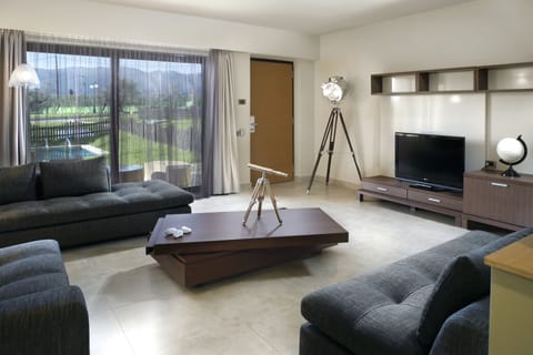 Executive Suite, Private Pool | Living room | TV