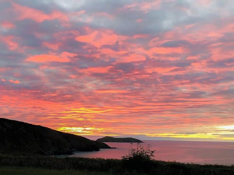 Sunset at Mwnt beach | Hafan Gwyn - Cardigan Bay Cottages, Felinwynt, near Cardigan