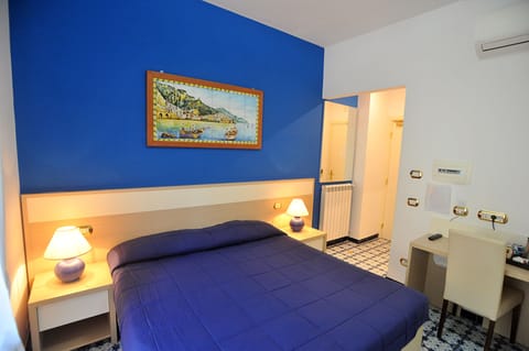 Triple Room | Minibar, in-room safe, individually furnished, desk