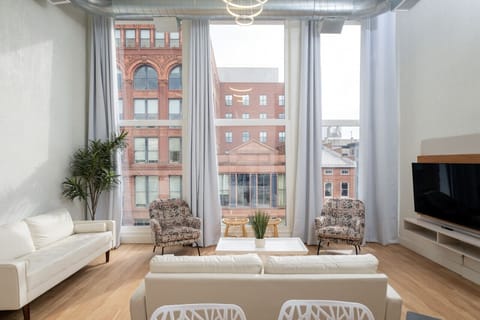 Comfortable lounging area with an open concept, lots of space and generous seating accommodations!