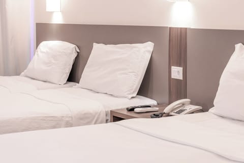 Deluxe Quadruple Room | Minibar, in-room safe, desk, free WiFi