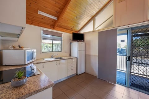 Deluxe Cabin - Sleeps 6 | Private kitchen | Full-size fridge, microwave, stovetop, cookware/dishes/utensils