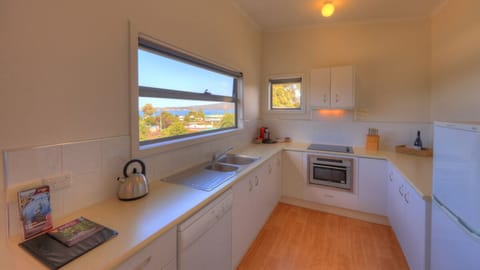 Ocean View Cottage 1 | Private kitchen | Full-size fridge, oven, stovetop, dishwasher