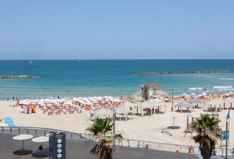 Beach nearby, white sand, beach towels, beach yoga