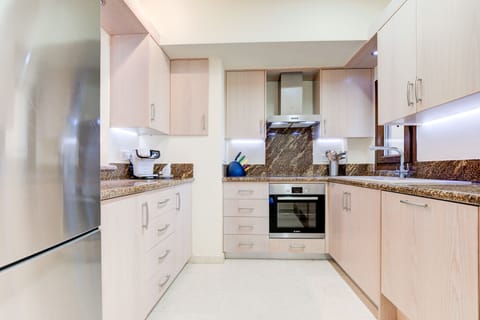 Luxury Apartment | Private kitchen | Full-size fridge, microwave, oven, stovetop