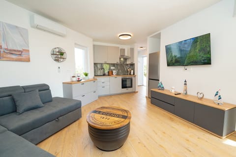 Apartment | Living area | 70-inch LCD TV with satellite channels, TV