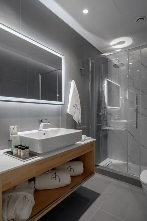 Apartment, 1 Bedroom (Private garden) | Bathroom | Shower, rainfall showerhead, hair dryer, bathrobes