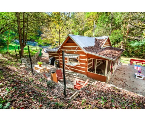 This picturesque cabin blends rustic charm with modern comfort, nestled in a tranquil wooded setting.