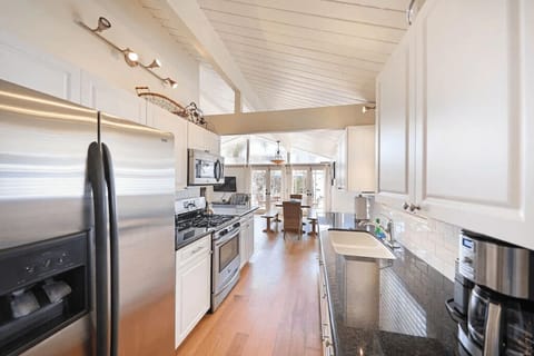 Bottom-level kitchen is stocked with dishes, cooking, baking and meal prep gear. All standard large and small appliances included. See listing description for more details.
                