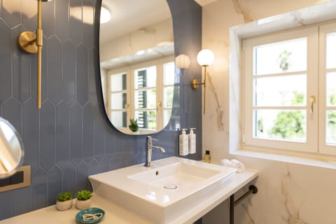 Superior Room | Bathroom | Rainfall showerhead, eco-friendly toiletries, hair dryer, bathrobes