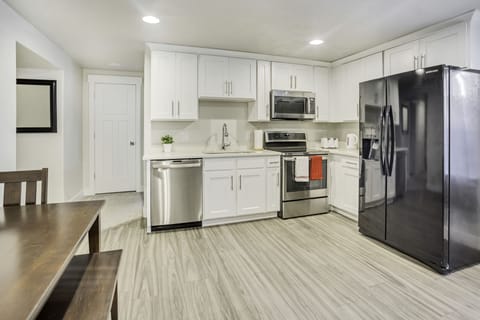 Design Apartment | Private kitchen | Full-size fridge, microwave, oven, stovetop