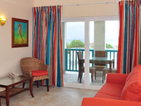 Deluxe Island View One Bedroom | Living area | Flat-screen TV