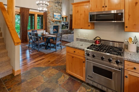 View from the kitchen into the dining and living room areas.