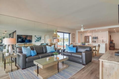 View of living room, dining space and kitchen
