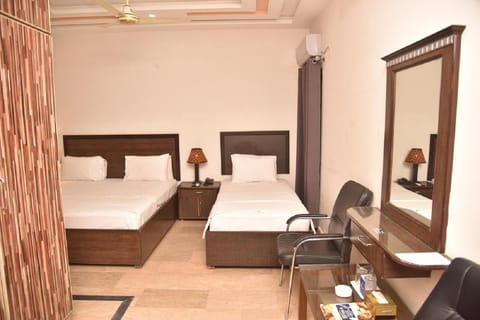 Deluxe Triple Room | Iron/ironing board, free WiFi, bed sheets