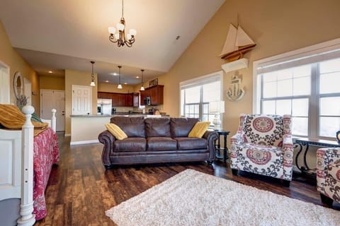 Large living room with sofa sleeper, 2 comfy chairs.