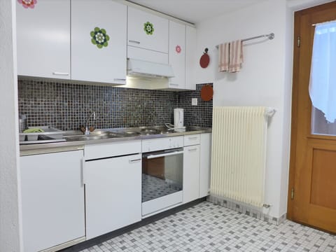 Cabinetry, Countertop, Kitchen, Interior Design, Flooring, Wood, Floor, Kitchen Stove, Tap, Building