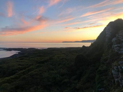 Cloud, Sky, Water, Natural Landscape, Highland, Plant, Afterglow, Coastal And Oceanic Landforms, Terrain, Dusk