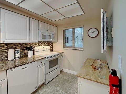 Condo, Multiple Beds, Balcony, Partial Sea View (207 - No Pets Allowed) | Private kitchen | Fridge, microwave, oven, stovetop