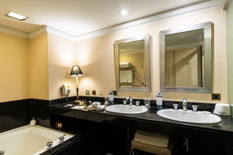 Suite, 1 Bedroom, City View | Bathroom | Combined shower/tub, deep soaking tub, free toiletries, hair dryer