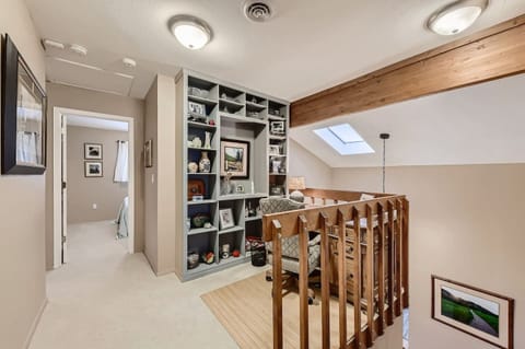 Bonus - There is a space on the top floor that may be referred to as 'an office.' Located at the landing on top of the stairs, this enormous desk and comfortable swivel office provides a great space in which to get some work done.