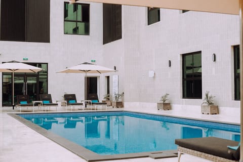 Outdoor pool, open 8:00 AM to 9:30 PM, pool umbrellas