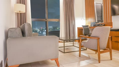 Premium Suite | Minibar, in-room safe, individually decorated, individually furnished