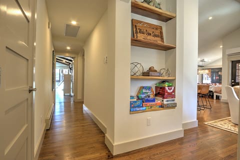 Hallway between main level bedrooms into living room