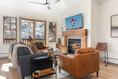 Cozy Up in this Updated Living Room with Gas Fireplace & Access to the Private Deck!