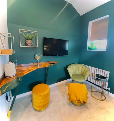 Green Leaf Room | Desk, laptop workspace, blackout drapes, iron/ironing board