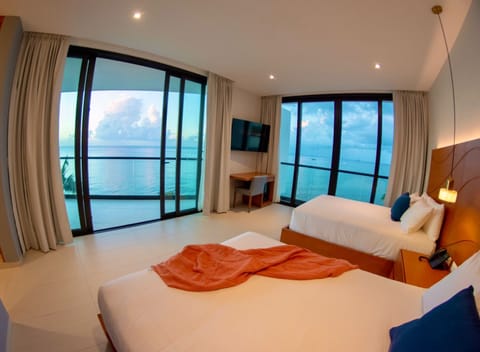 Deluxe Room, 2 Double Beds, Non Smoking, Ocean View | Minibar, in-room safe, individually decorated, desk