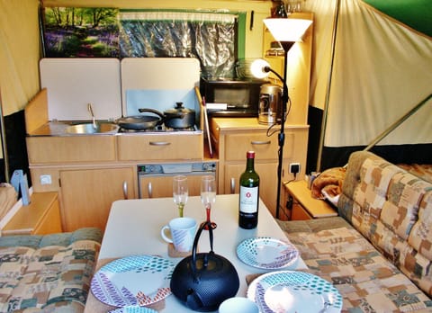 2 sofas, large table and kitchen taken from door